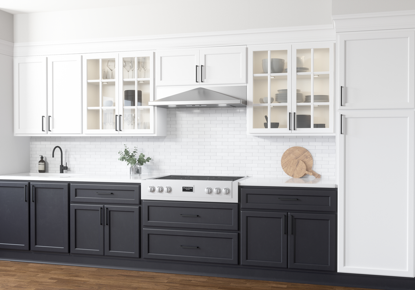 Stainless steel under cabinet range hood installed above modern electric cooktop in kitchen and home improvement setting