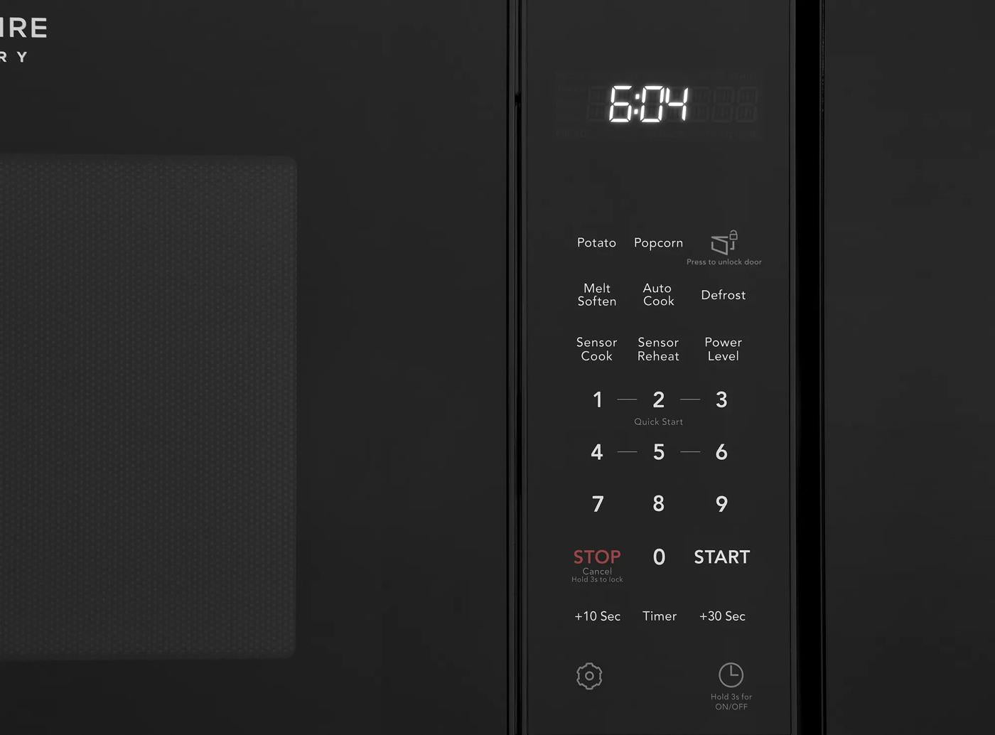 Built-in microwave control panel with digital clock, sensor cook, reheat options, and preset cooking buttons for kitchen use