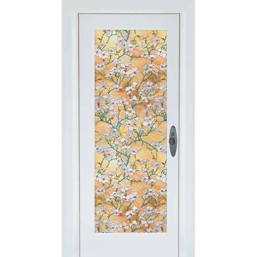 White dogwood floral privacy film with green branches on warm amber background on narrow door window panel