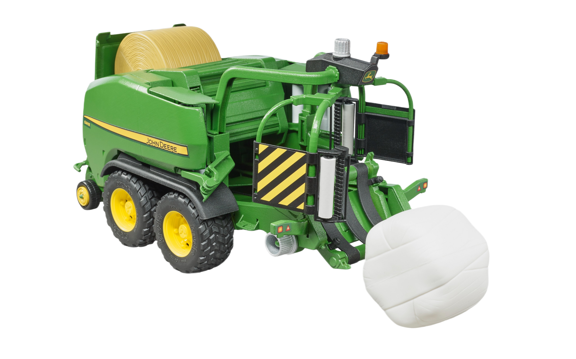 Green and yellow toy agricultural baler with wrapped white bale from Bruder Toys in Vehicles & Remote Controlled Toys collection