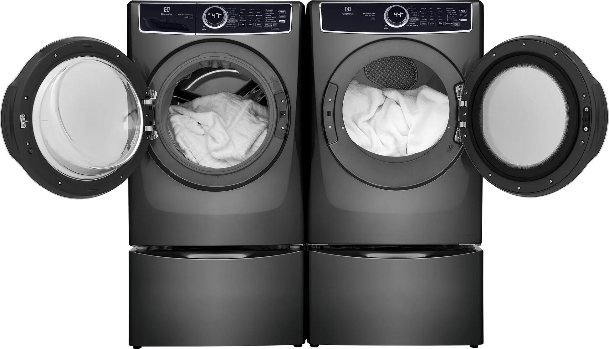 Pair of dark gray front load washer and dryer with open doors showing white laundry inside from dryers collection
