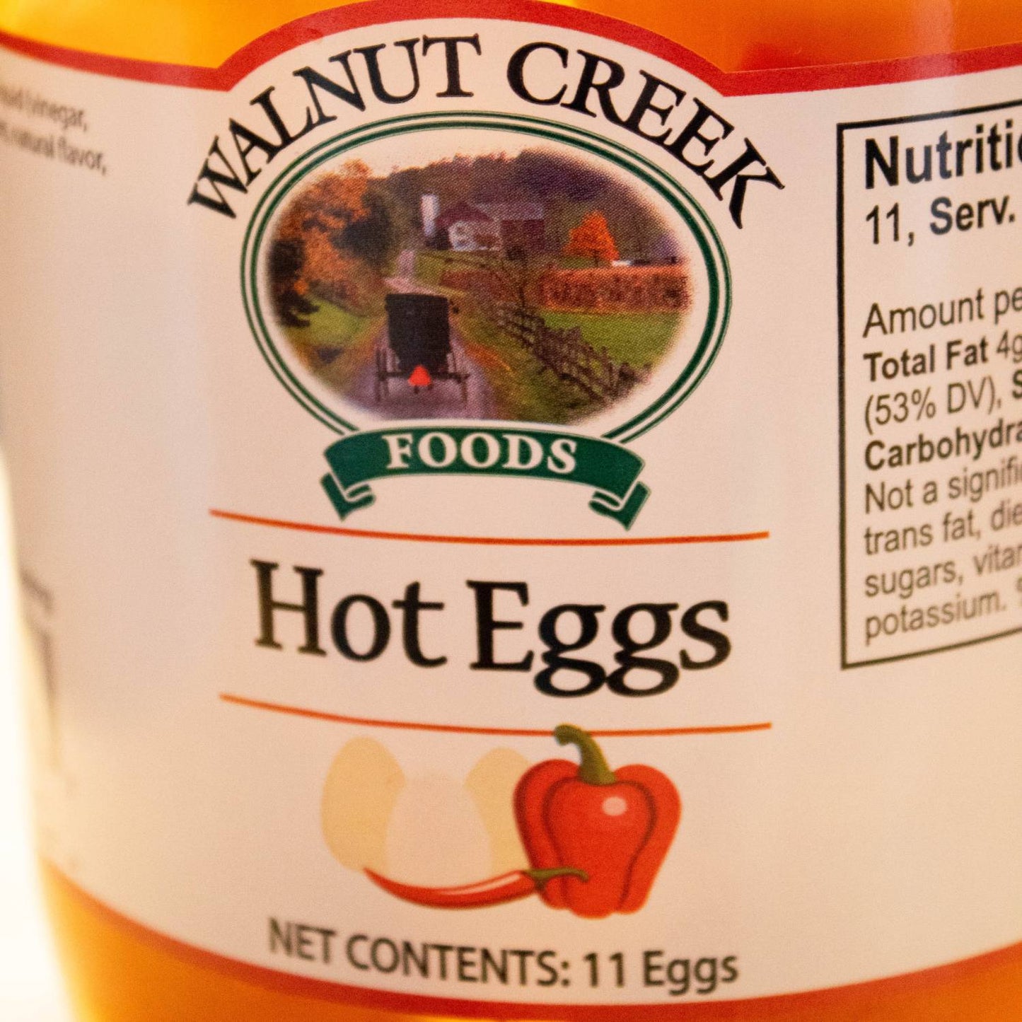 Close-up of a jar label showing hot pickled eggs with chili pepper in fruits and vegetables under $50 collection