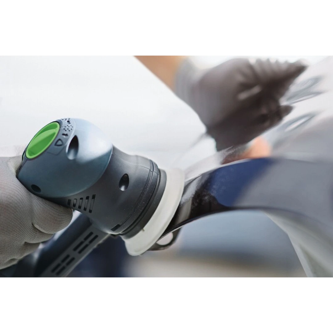 Handheld power sander with soft Festool sanding pad smoothing curved glossy surface in woodworking tools collection