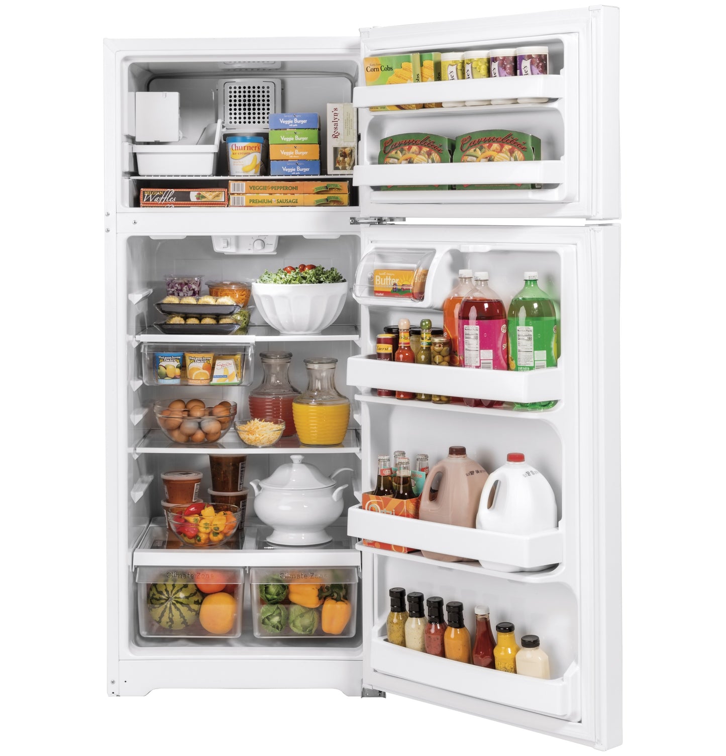Open white top-freezer refrigerator filled with various groceries, fruits, and beverages in kitchen appliance collections