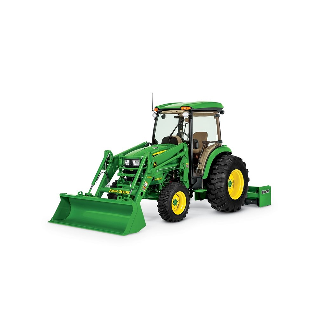Green compact utility tractor with front loader and cab for landscaping and home improvement tasks
