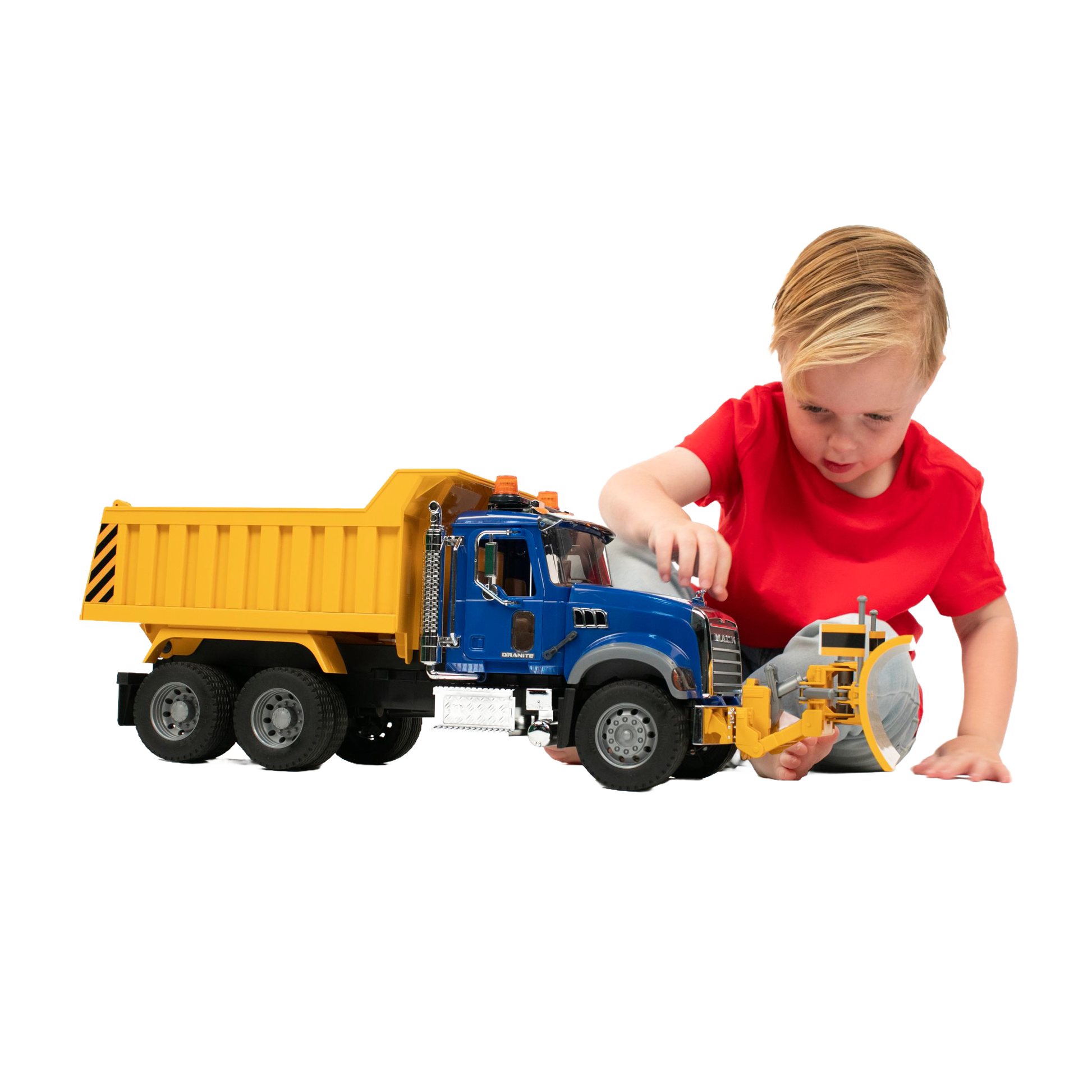 Young child in red shirt playing with detailed blue and yellow Bruder Toys 1:16 scale dump truck in Vehicles & Remote Controlled Toys collection