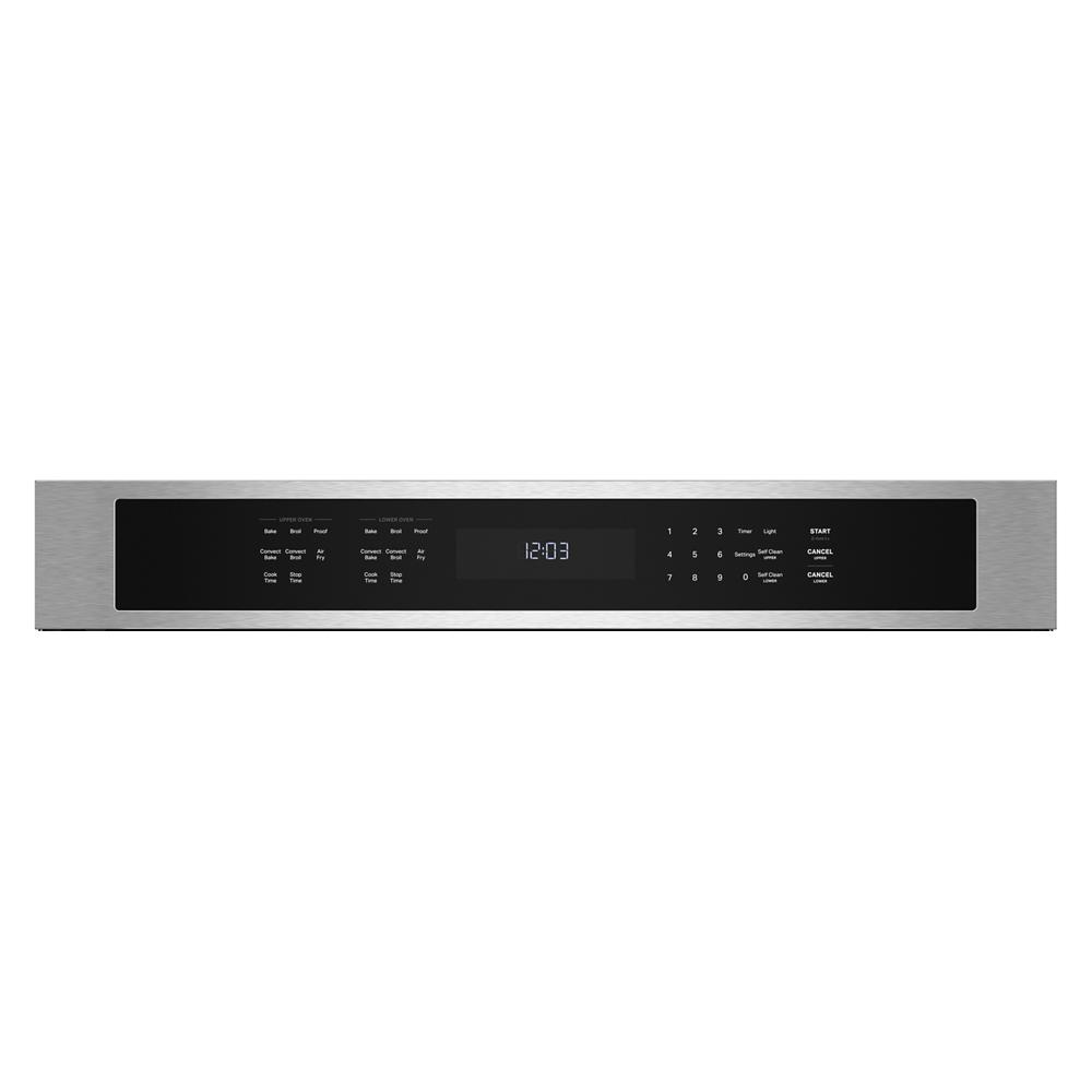 Stainless steel oven control panel with digital clock and touch buttons for temperature and cooking settings