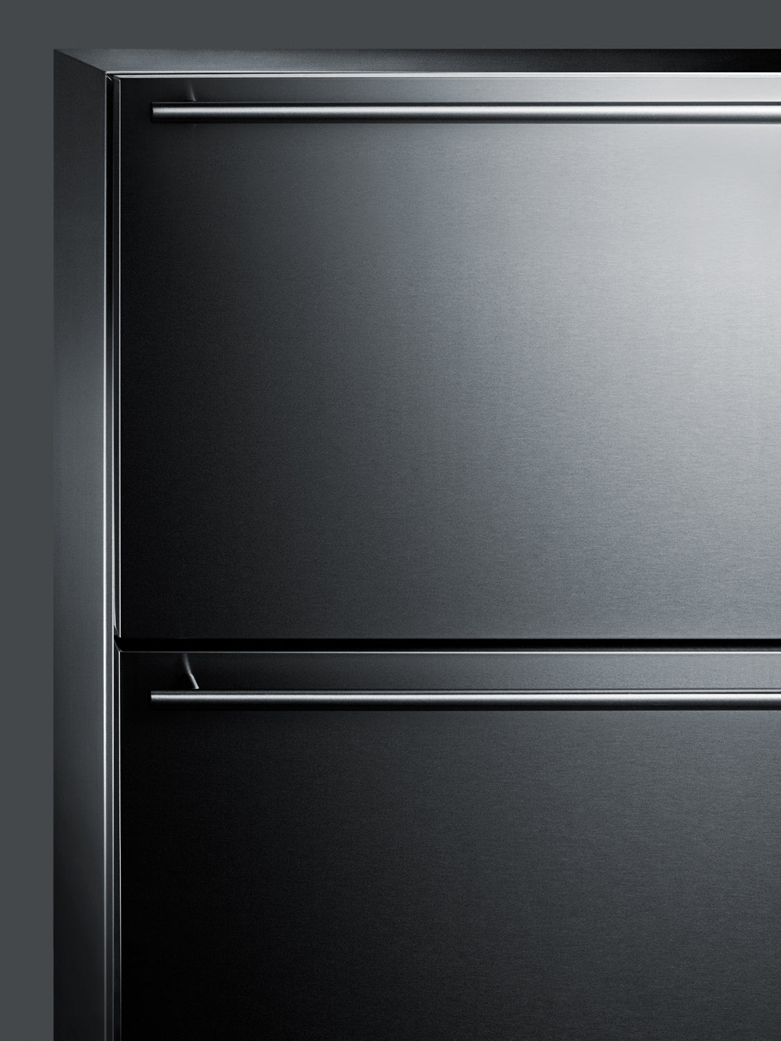 Close-up of sleek stainless steel built-in freezer with two horizontal drawer handles in kitchen appliances collection