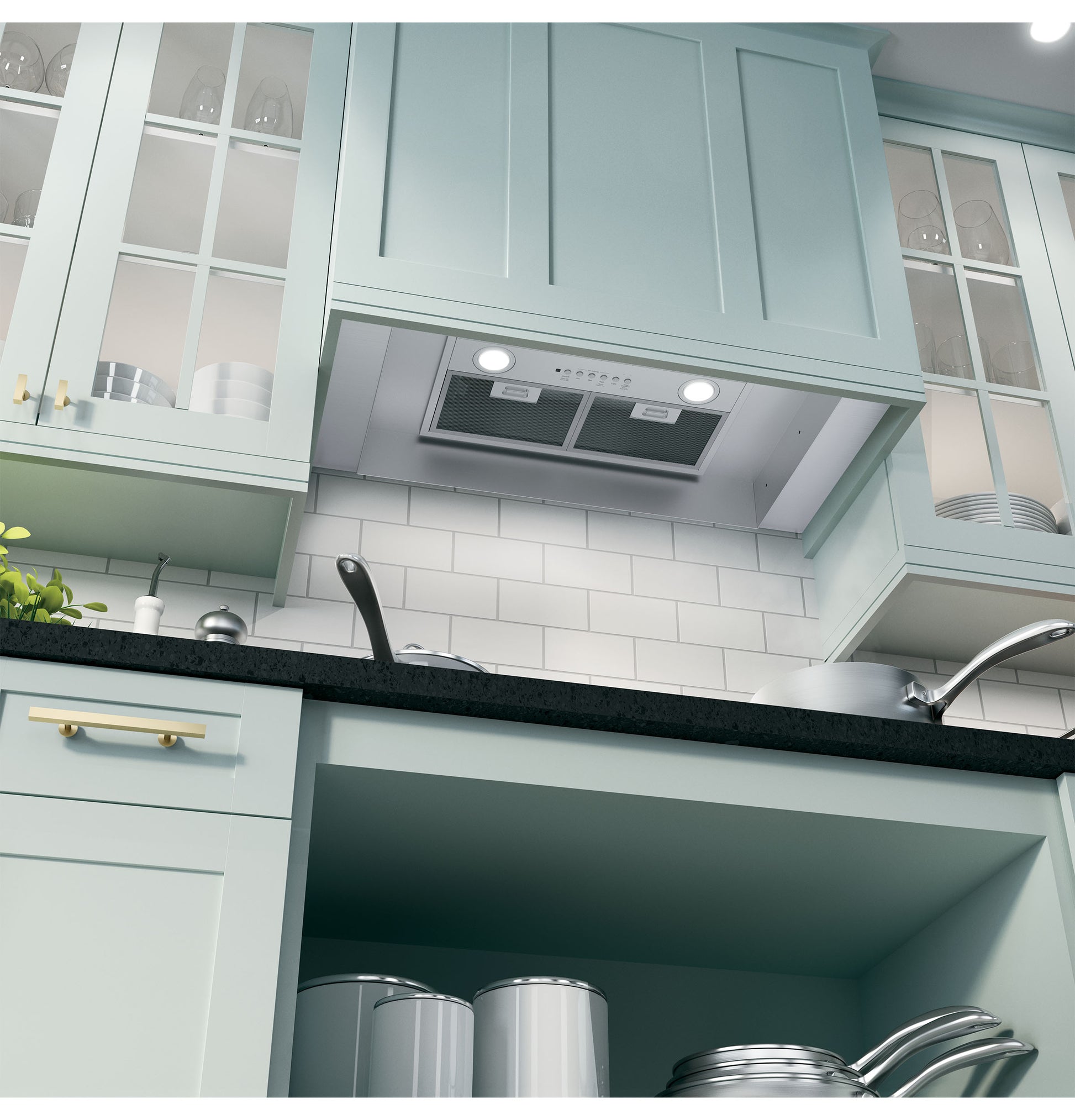 Under-cabinet custom hood insert with dual fans and dimmable LED lights in a modern kitchen setting