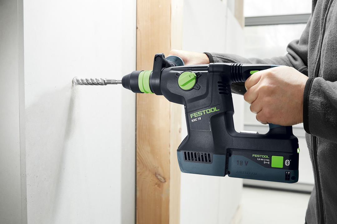 Cordless rotary hammer drill with brushless motor used on drywall for home improvement and woodworking tasks