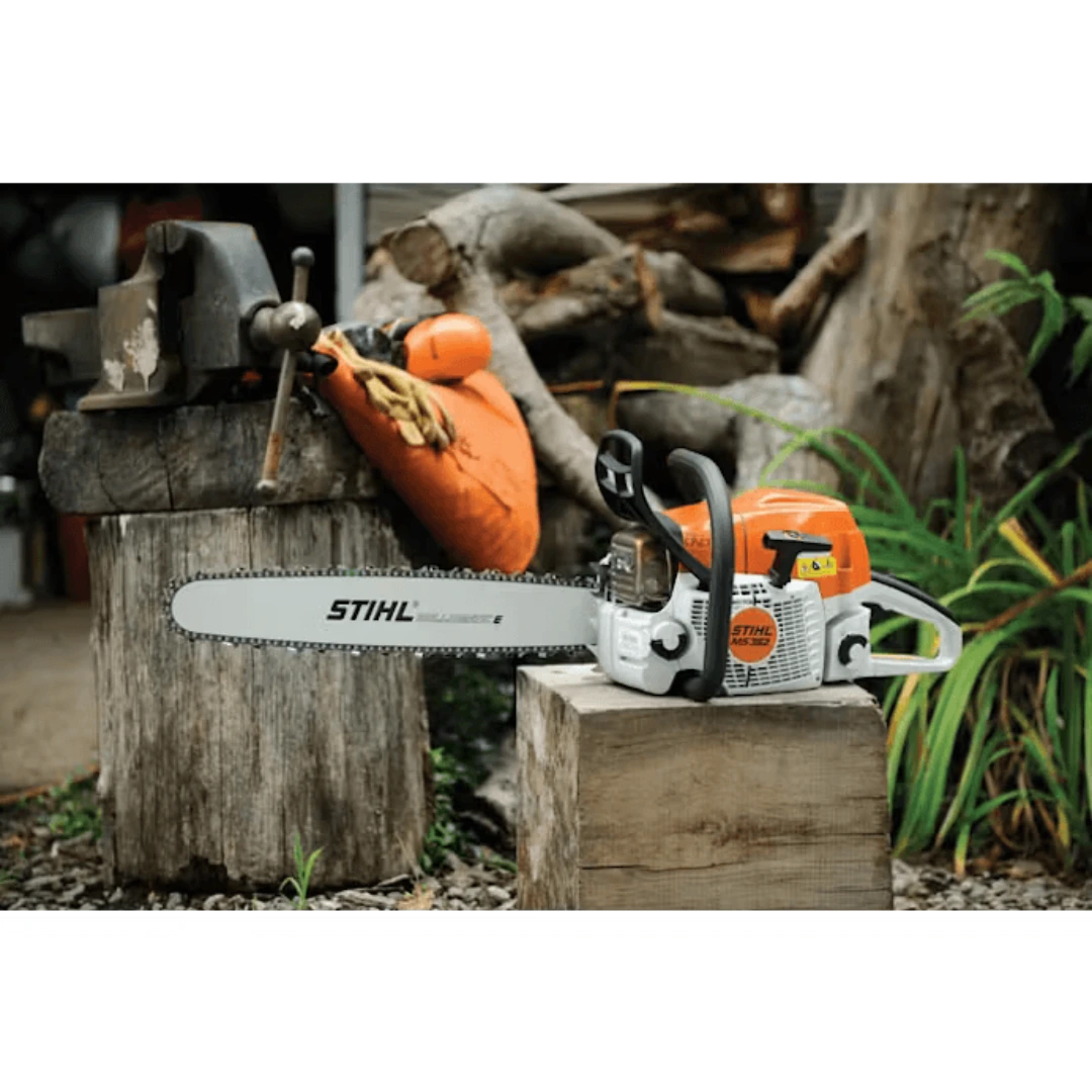 Orange and white gas-powered chainsaw with 18-inch bar placed on wooden stump in outdoor tools and home improvement setting