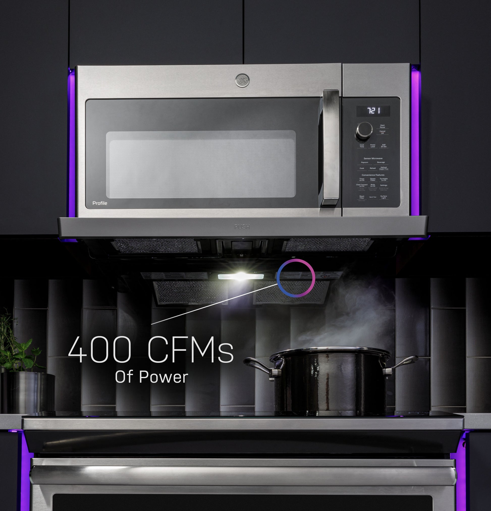 Stainless steel over-the-range microwave with digital display and extendable vent above stovetop in modern kitchen