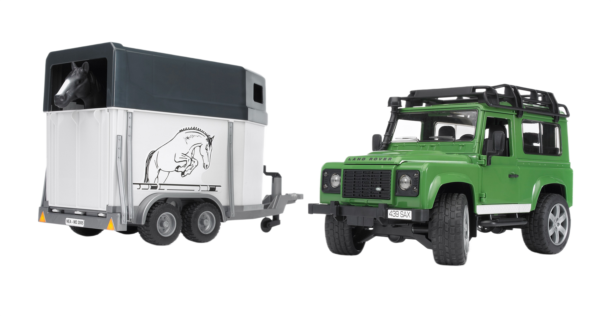 Green Land Rover toy pulling a white horse trailer with a black horse figure inside and detailed exterior design