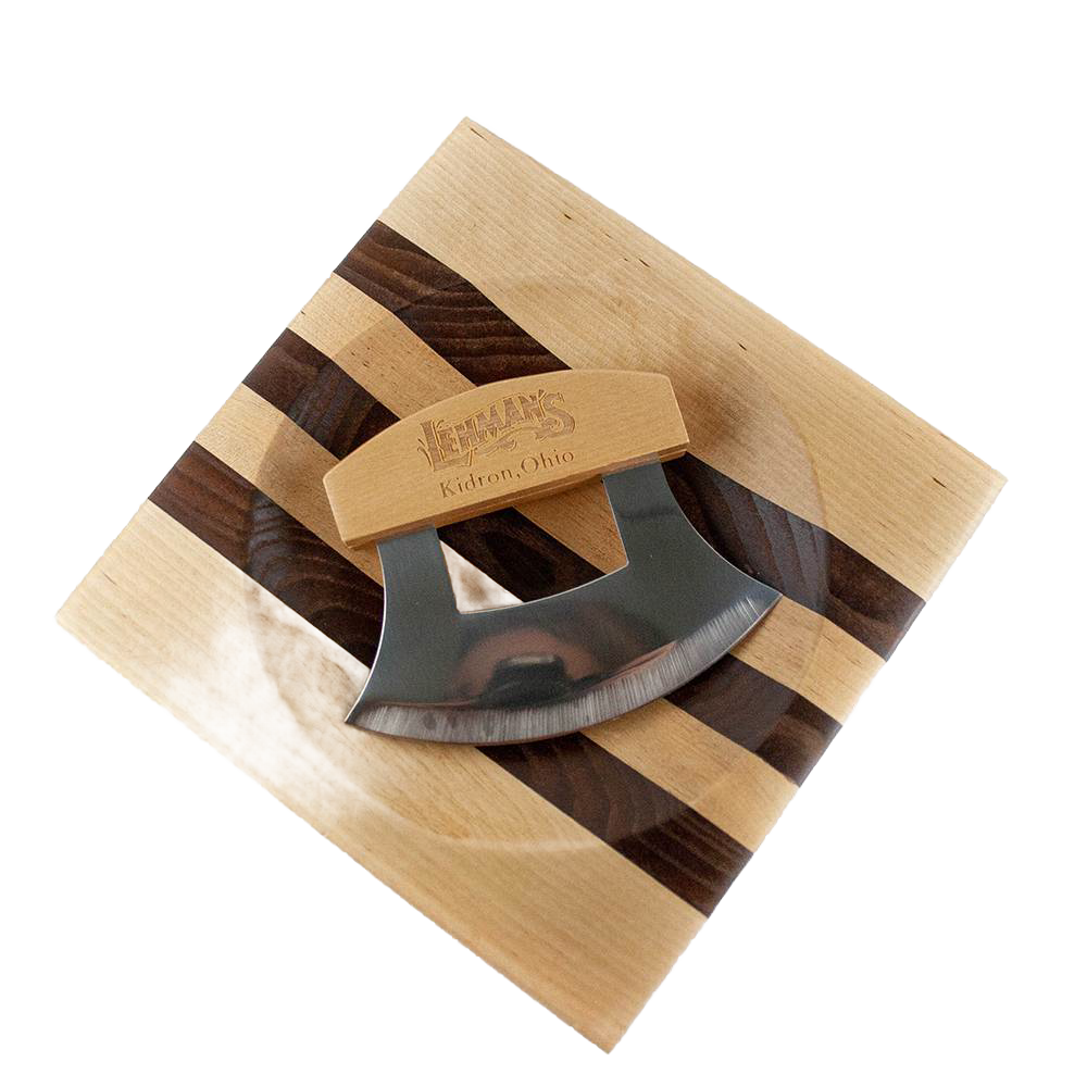 Curved stainless steel ulu knife with wooden handle resting on striped wooden cutting board from kitchenware collections.