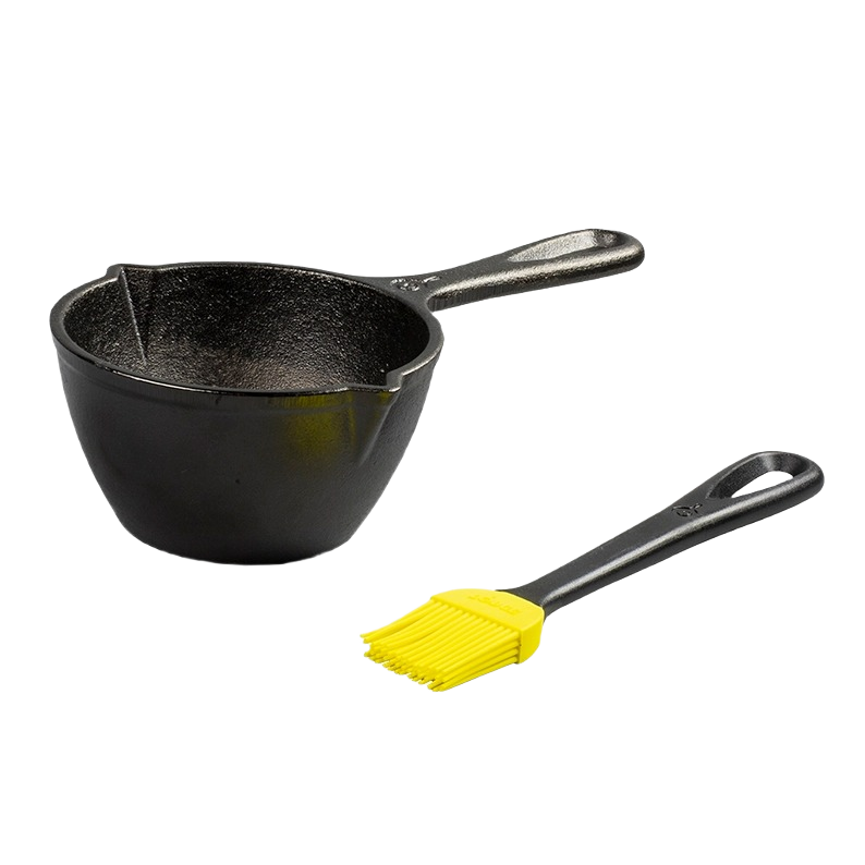 Black cast iron melting pot with handle and yellow silicone brush for tools and home improvement use