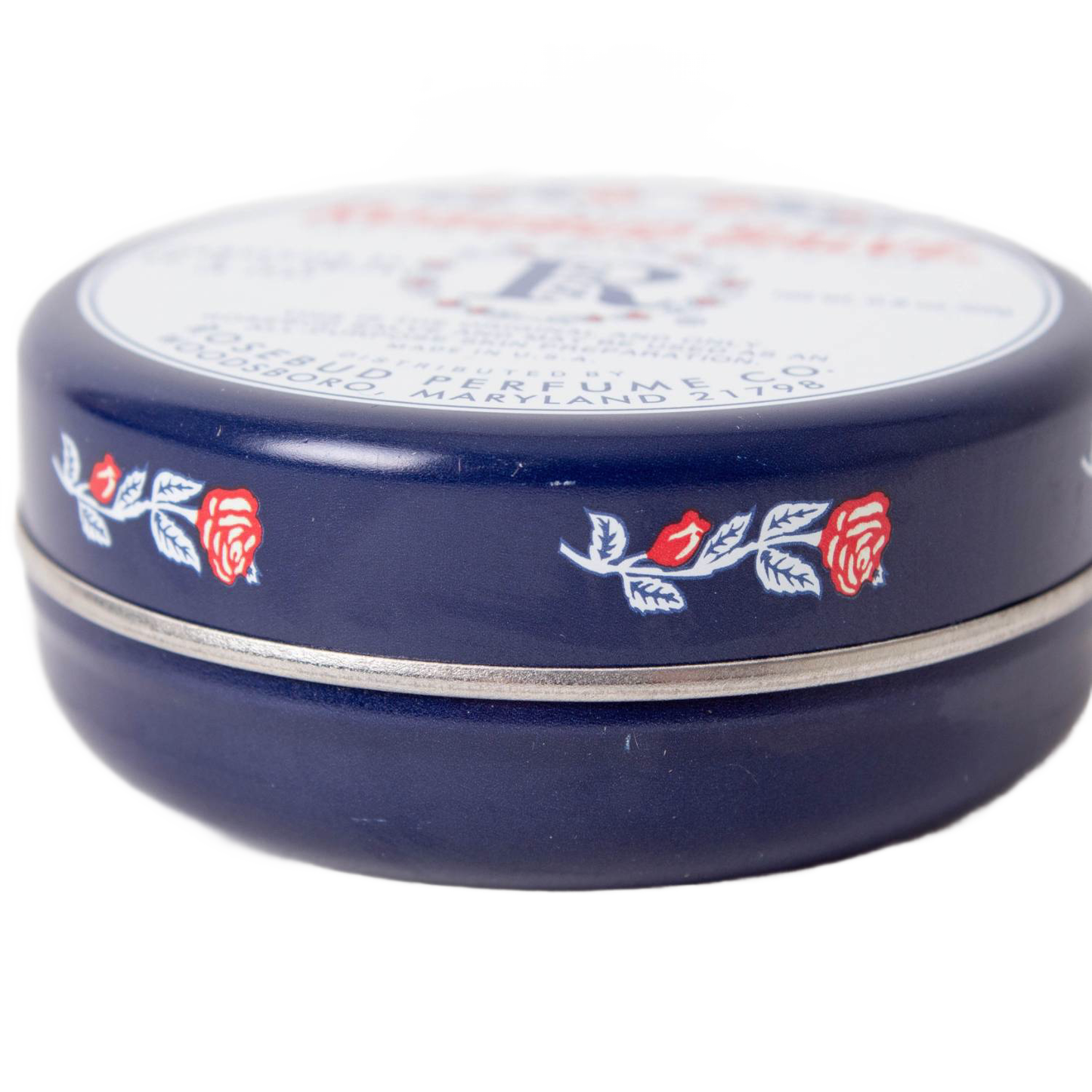 Dark blue round tin of Rosebud Salve featuring red rose and leaf design from Health & Beauty under $50 collection