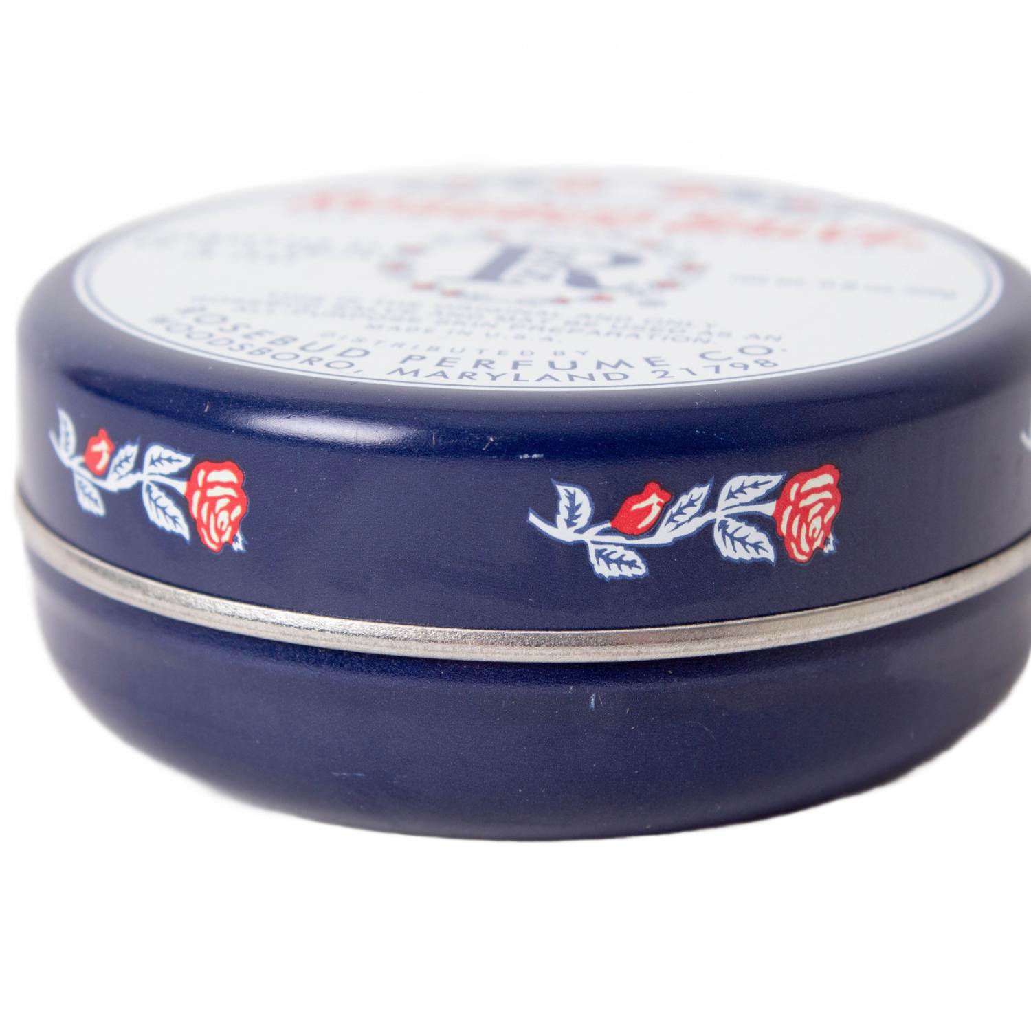 Dark blue round tin of Rosebud Salve featuring red rose and leaf design from Health & Beauty under $50 collection