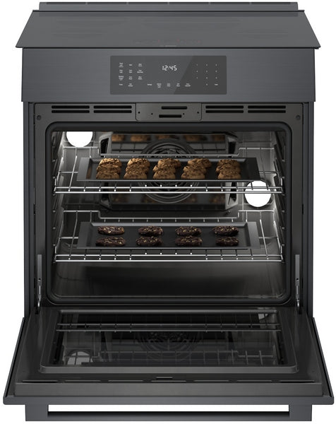 Black stainless steel slide-in oven with digital touch control and baking trays of cookies in kitchen appliances collection