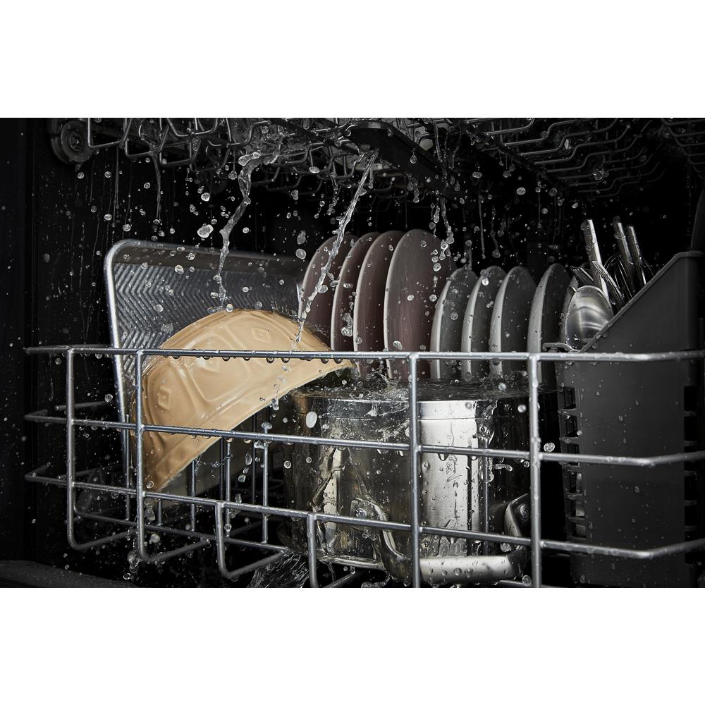 Interior view of dishwasher rack with plates, cookware, and utensils being cleaned in Kitchen & Kitchenware collection