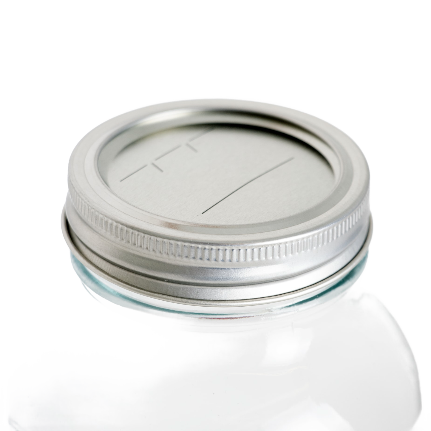 Silver-tone regular-mouth canning lid and band with date marking lines on clear glass jar in kitchenware under $50 collection