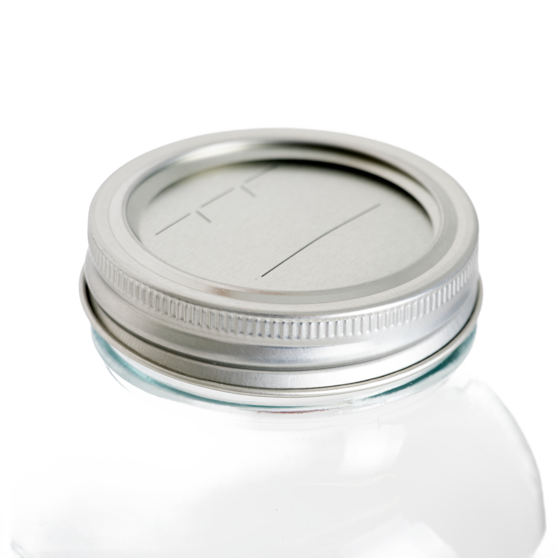 Silver-tone regular-mouth canning lid and band with date marking lines on clear glass jar in kitchenware under $50 collection