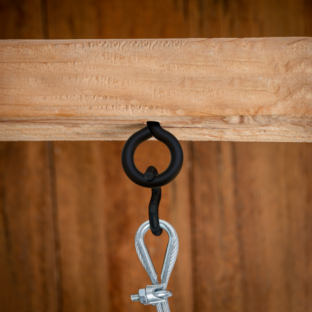Black lag eye screw with looped design mounted in wood holding metal clip for hardware and home improvement tools under $50