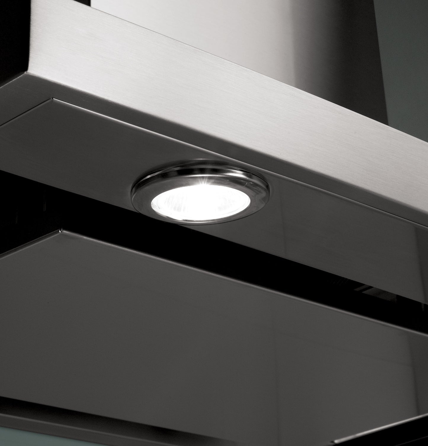 Close-up of stainless steel wall-mounted vent hood with built-in round LED light from Kitchen & Kitchenware collection