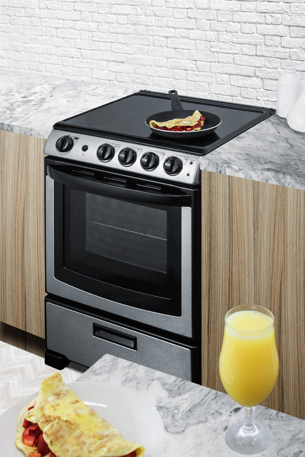 24-inch electric smooth-top stainless steel range with front controls in modern kitchen setup with food and drink