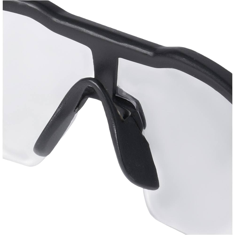 Close-up of clear lens safety glasses with black frame and flexible nose pads for protective eyewear and safety gear use