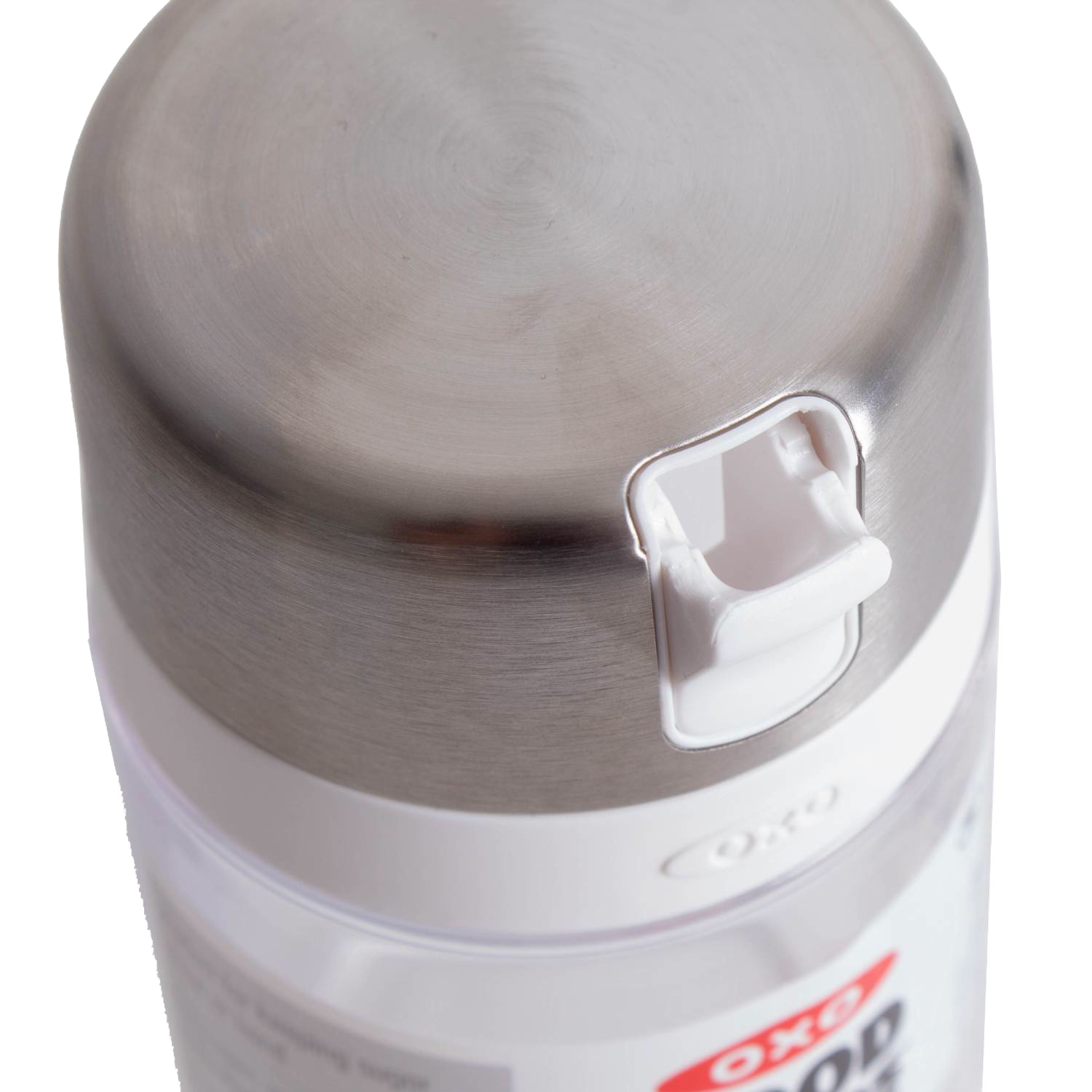 Close-up of stainless steel lid with white flip-top spout on clear sugar dispenser for kitchen storage and organization