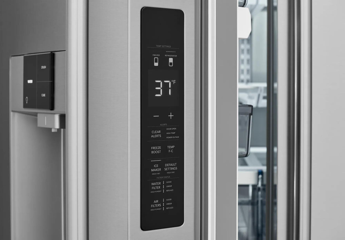 Close-up of stainless steel refrigerator exterior with digital temperature control panel and dispenser in appliances collection