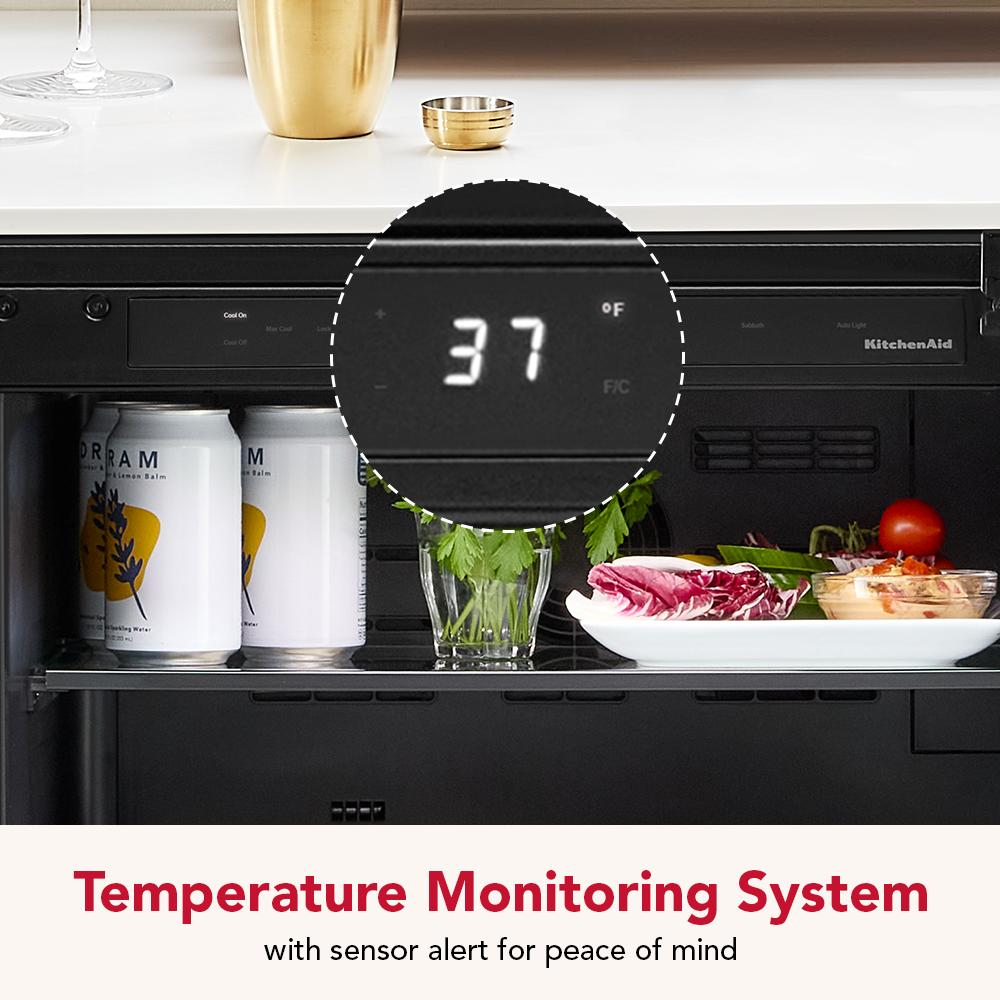 Interior view of undercounter refrigerator with digital temperature display showing 37°F and fresh food inside