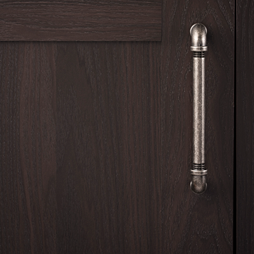 Black nickel vibed pipeline style cabinet pull on dark wood door in hardware and furniture accessories collections