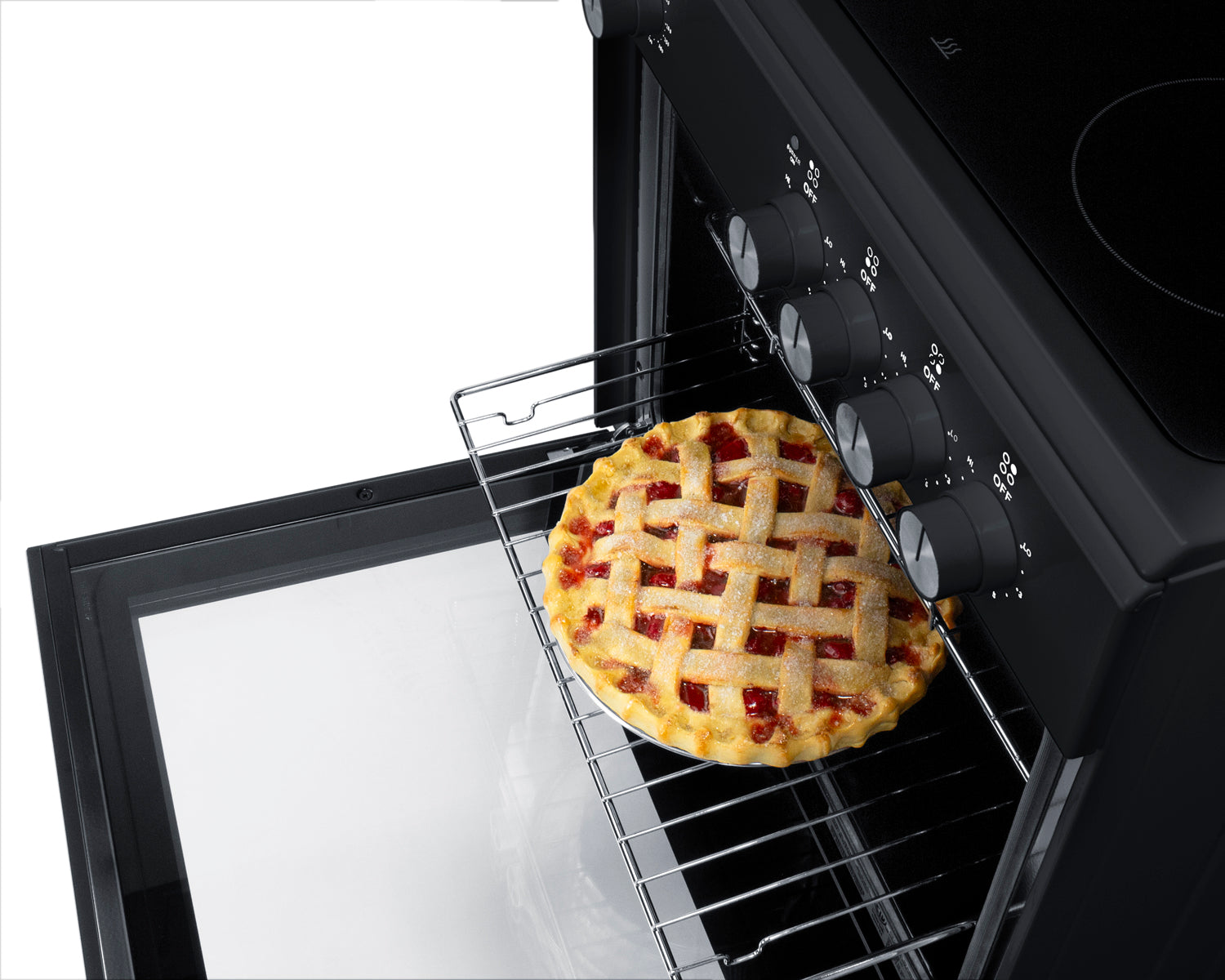 Electric smooth-top range with open oven door and lattice-topped pie on wire rack in kitchen appliance setting