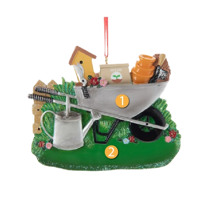 Wheelbarrow Christmas ornament with gardening tools and watering can on green grass base decoration under 50 dollars