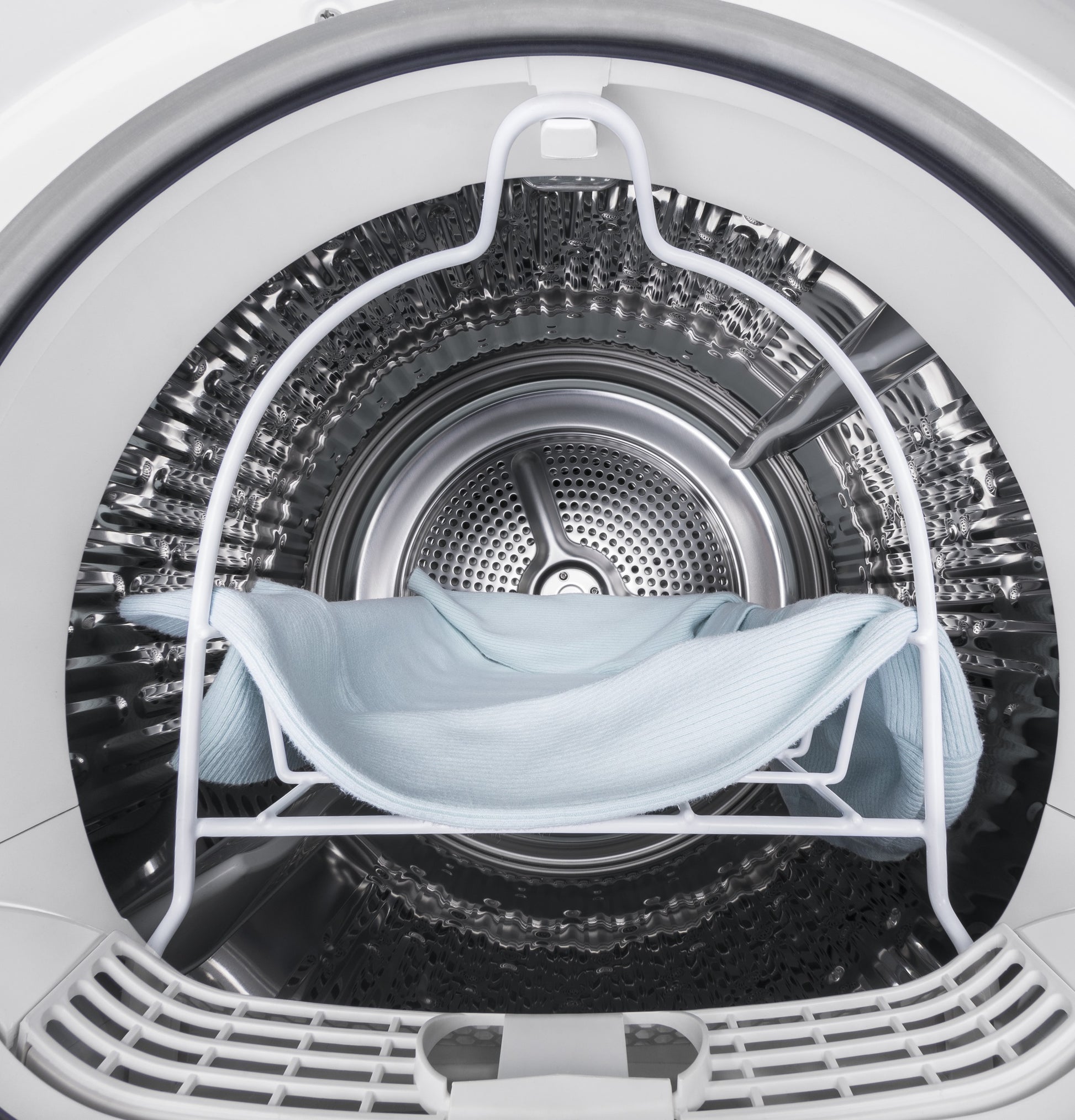 Interior view of front-load electric dryer with stainless steel drum and rack for delicate drying in appliances collection