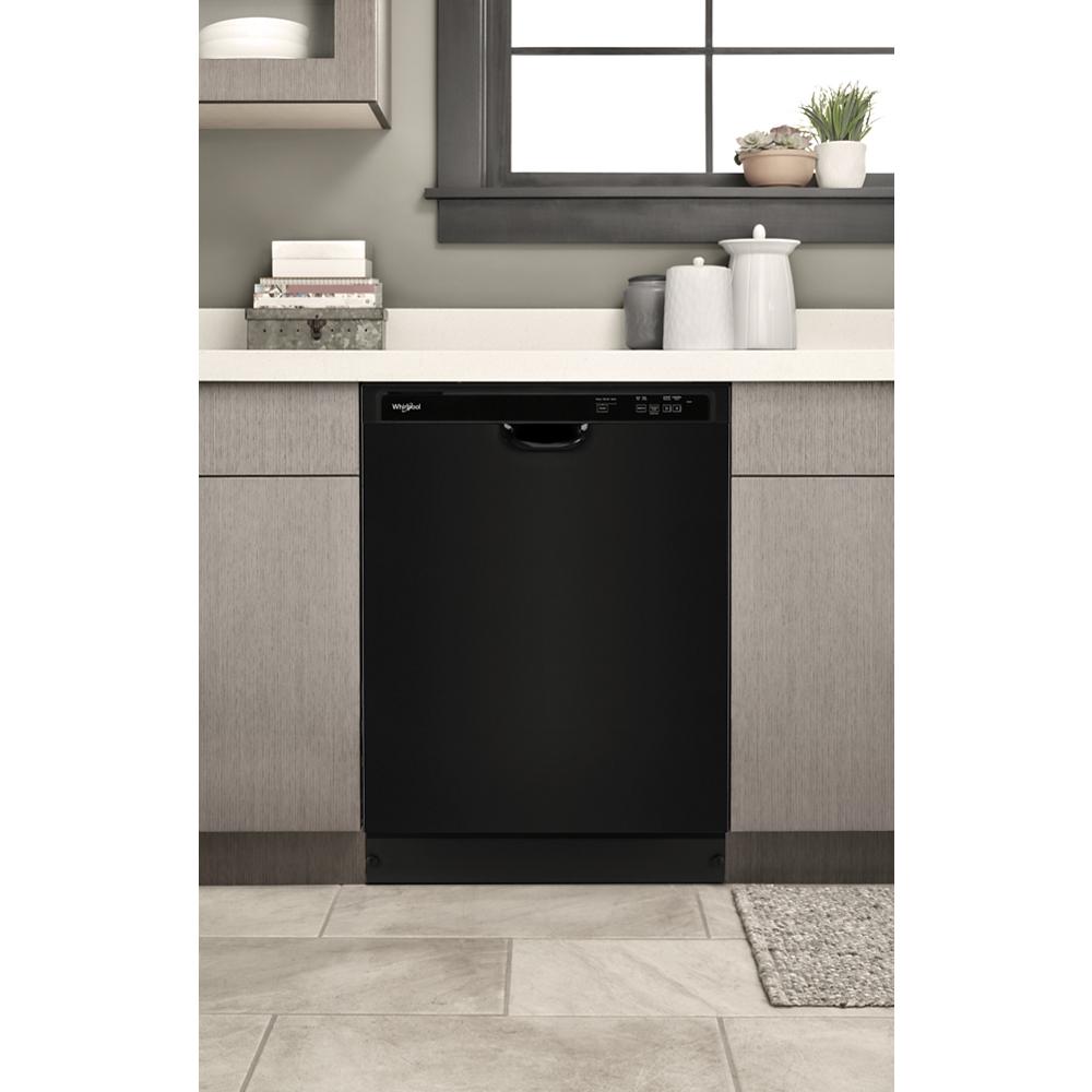 Black built-in dishwasher with digital controls installed under kitchen countertop in modern kitchen setting