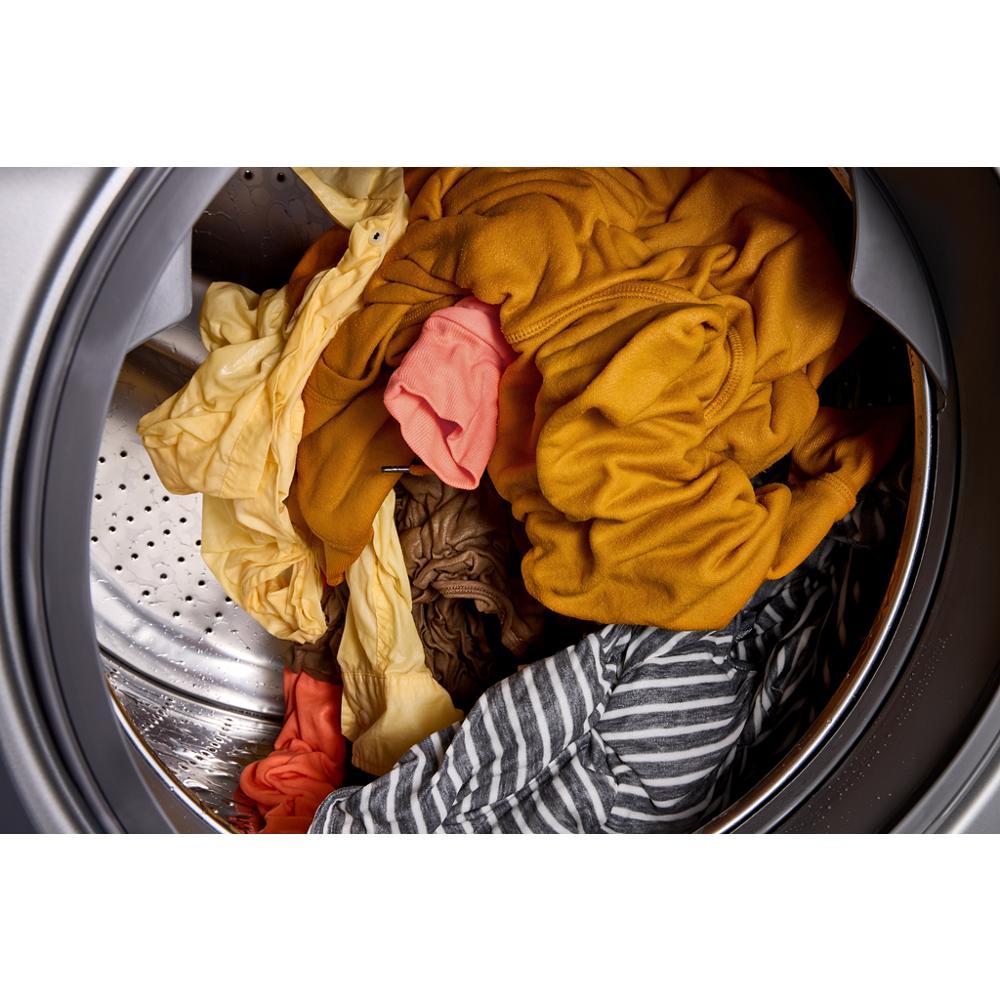 Interior view of front load washer filled with colorful clothes in Washers and Appliances collections