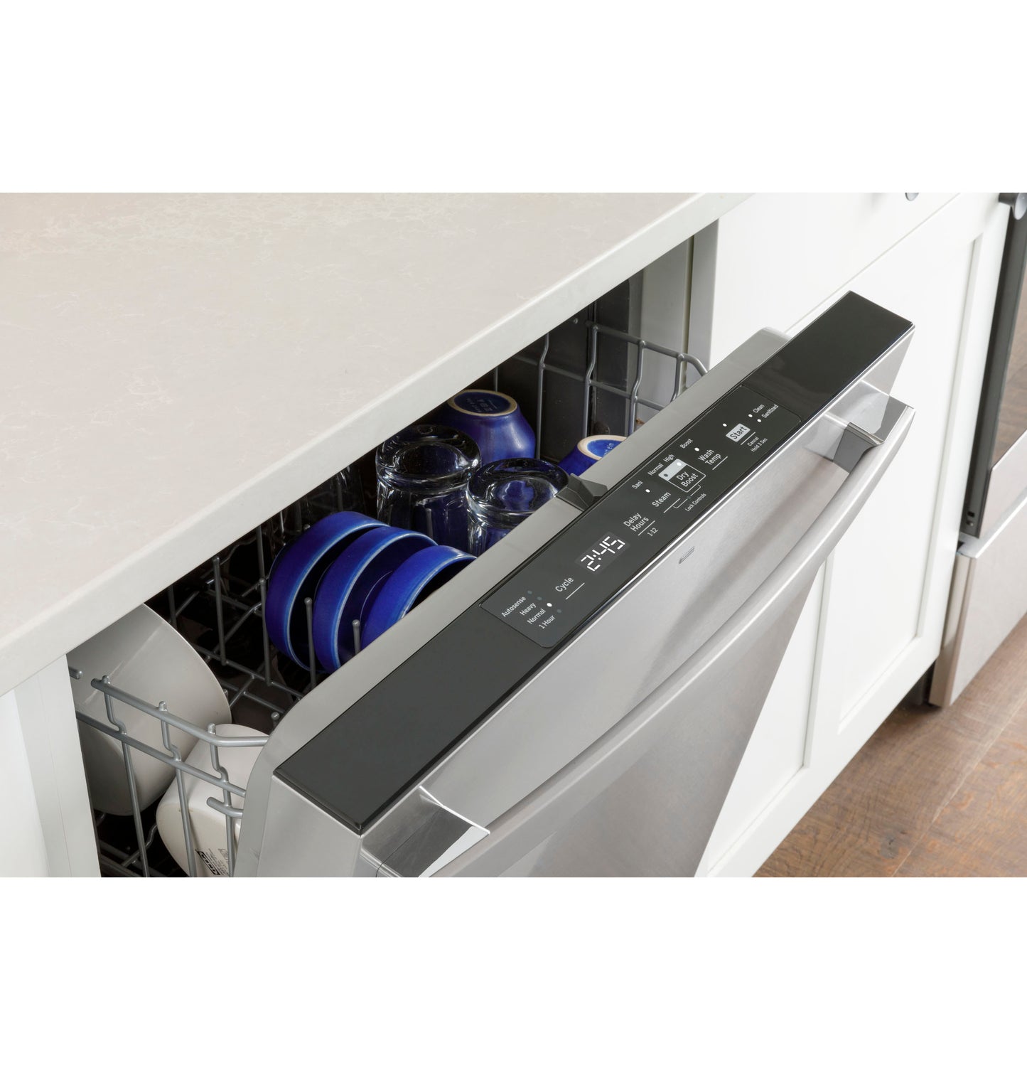 Top-control stainless steel dishwasher with digital display door open showing loaded interior in kitchenware collection