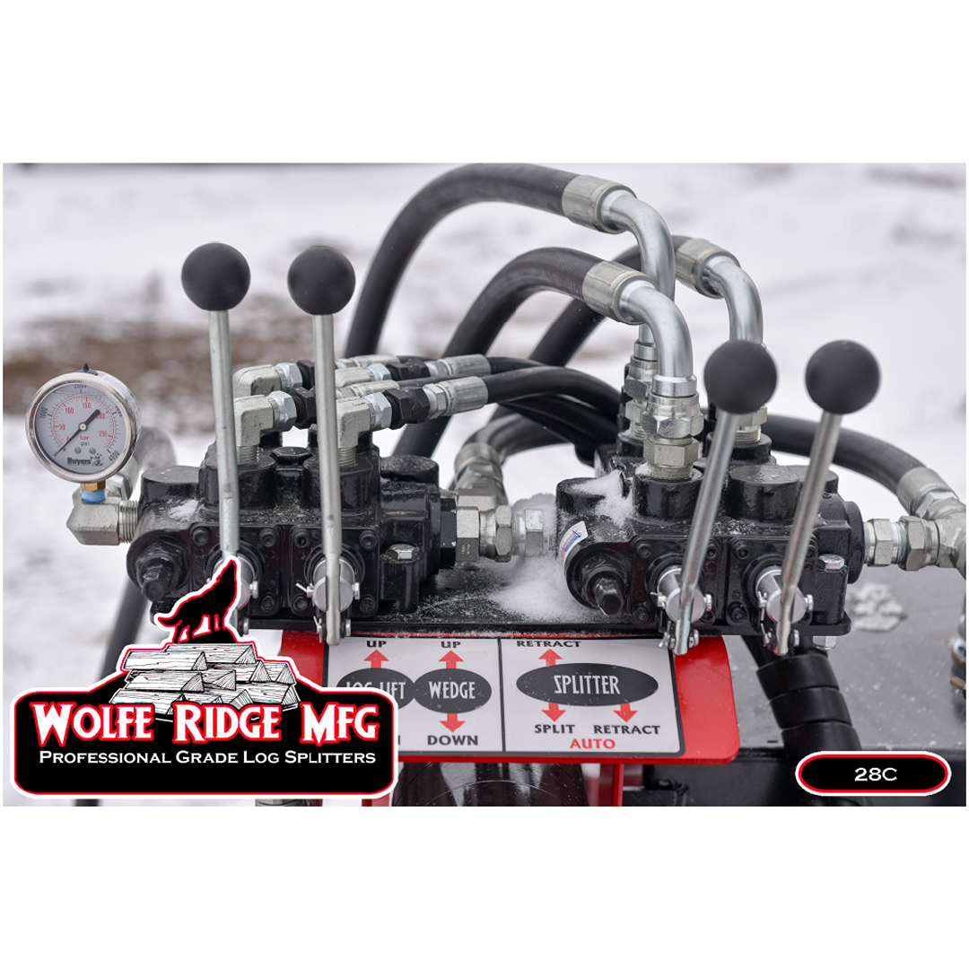 Hydraulic control panel with pressure gauge and levers on Wolfe Ridge 28 Ton Compact Commercial log splitter outdoors