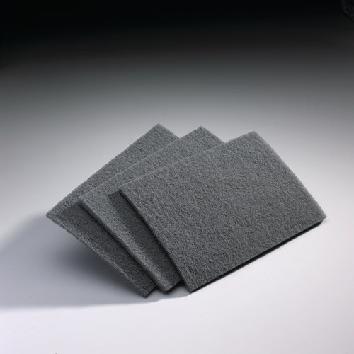Set of three gray abrasive sanding pads designed for finish sanding in tools and home improvement projects