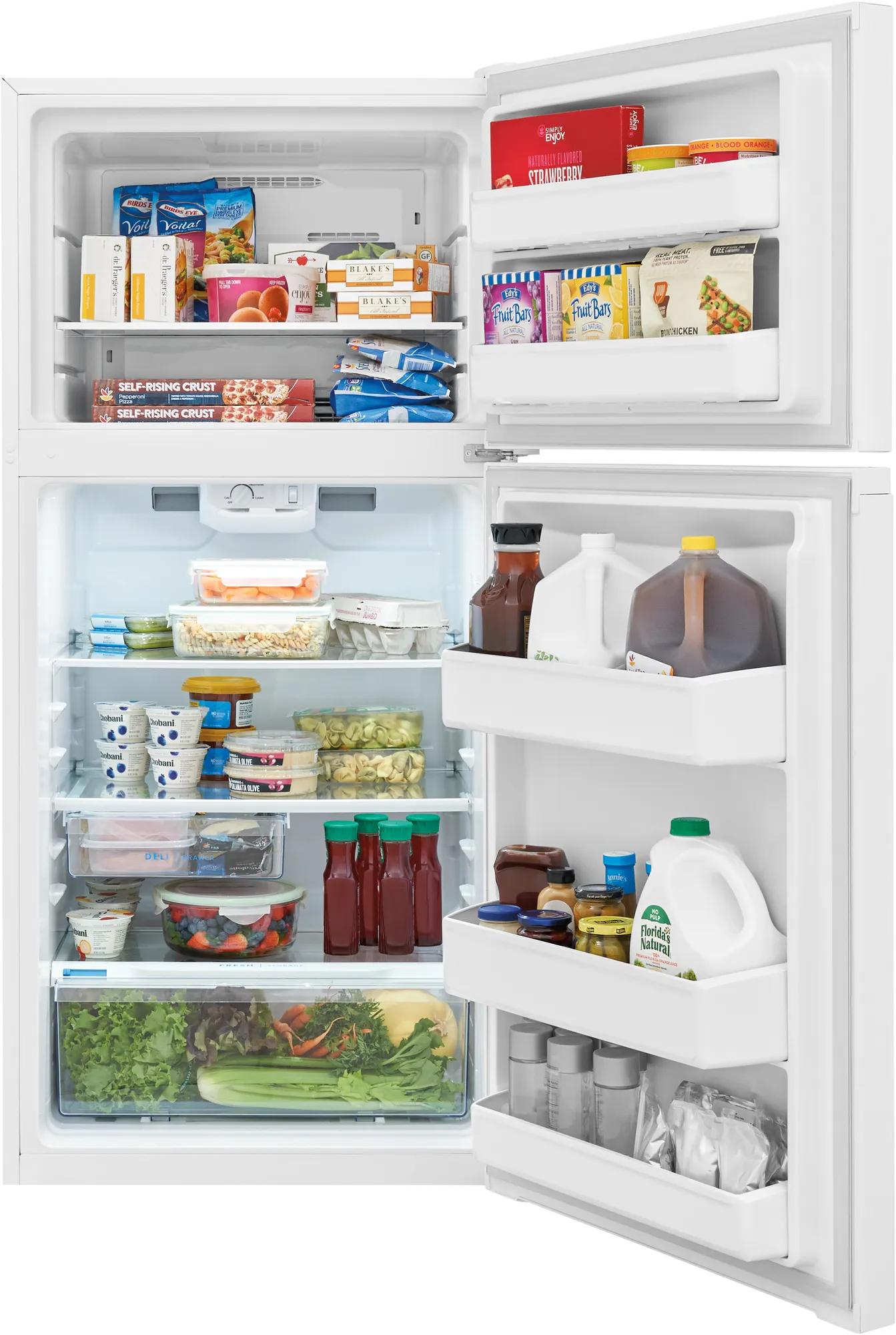 Open white top freezer refrigerator filled with assorted food and beverages for kitchen appliances and home improvement