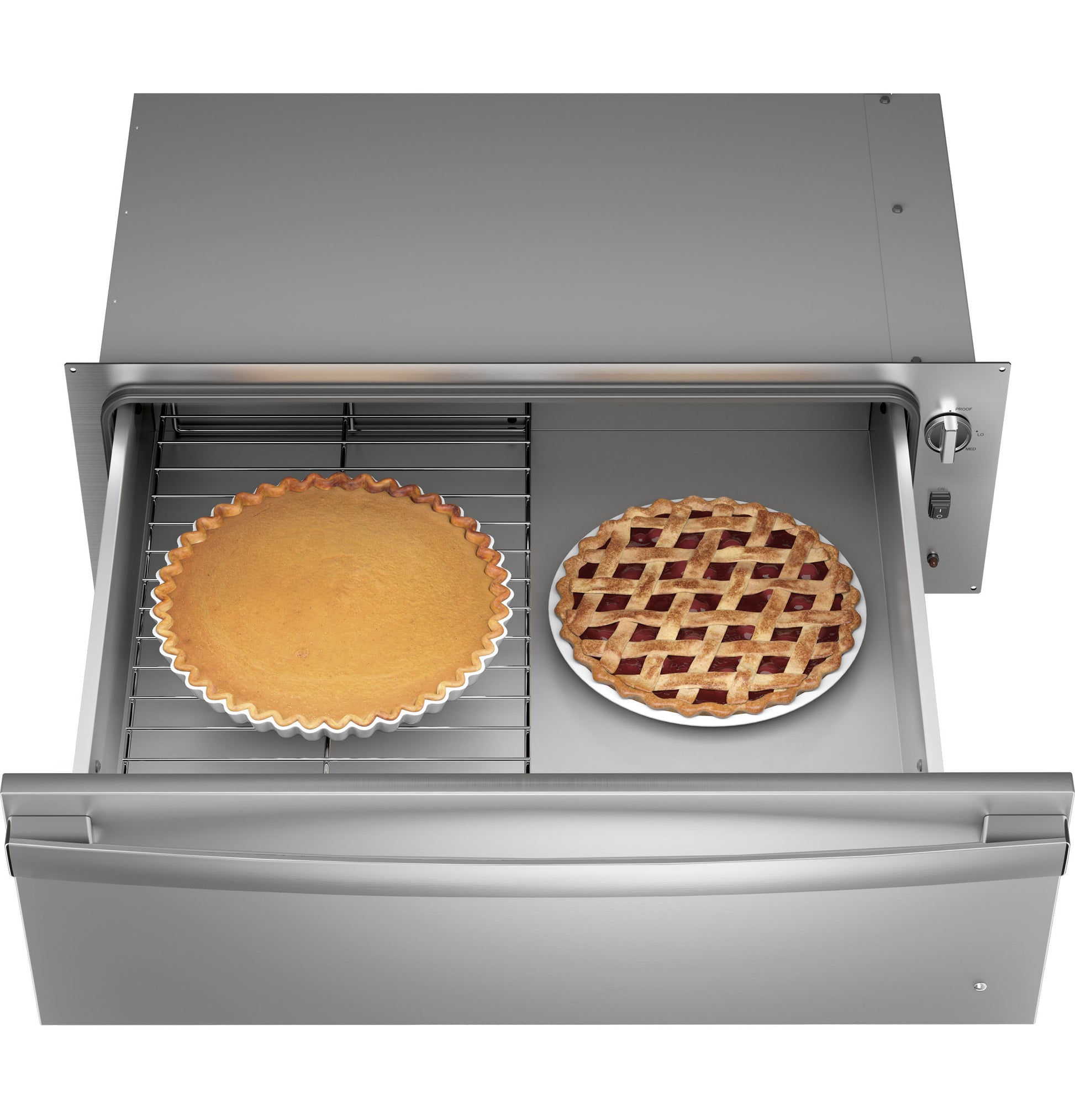 Stainless steel warming drawer open with pumpkin and lattice-topped pies inside in kitchen appliance collection