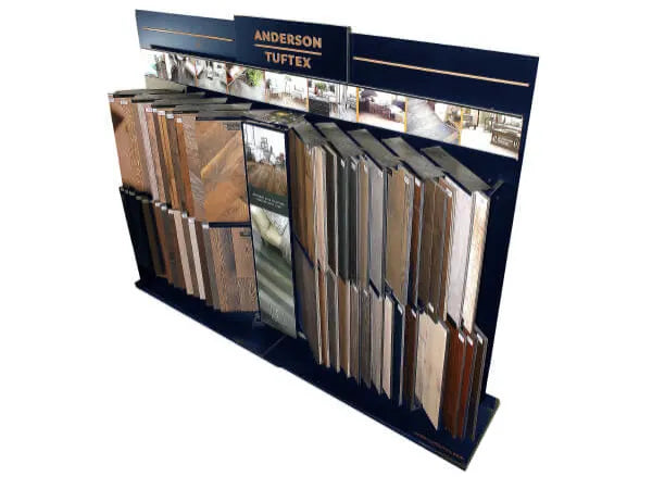 Display stand showcasing various samples of wood and laminate flooring in different shades and textures, labeled with the brand name Anderson Tuftex.
