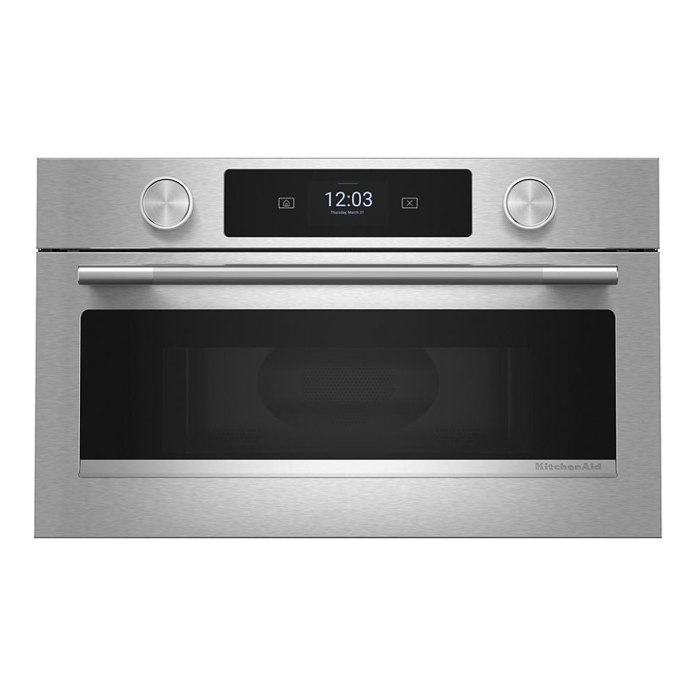 Front view of stainless steel built-in microwave oven with digital display and control knobs from KitchenAid Appliances collection