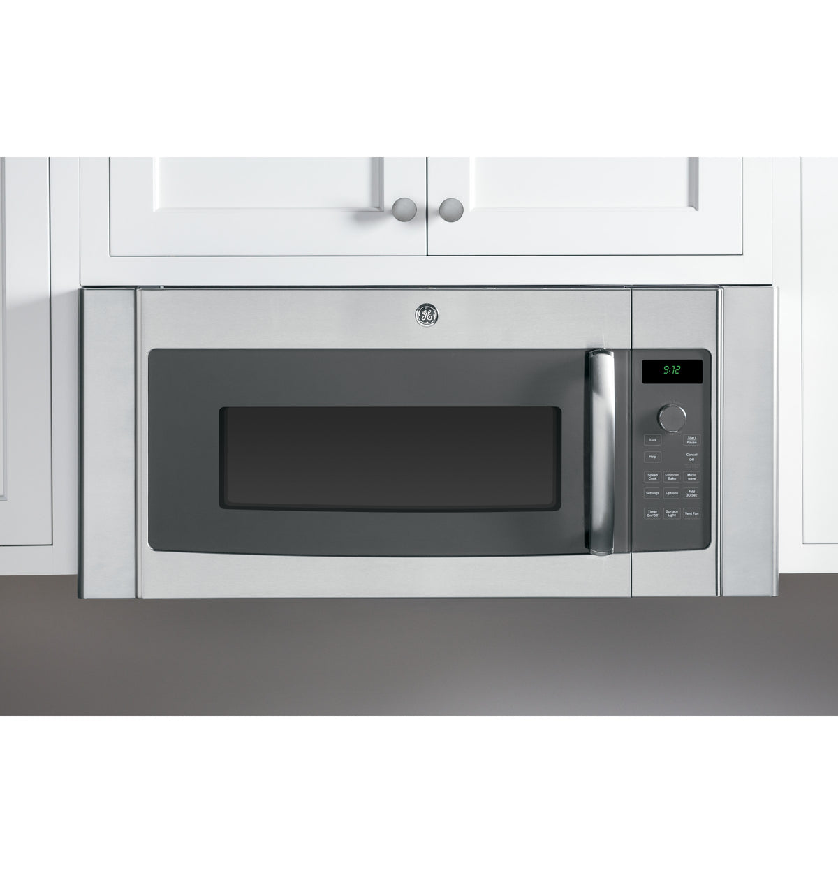 Stainless steel over-the-range microwave surrounded by white cabinetry in Kitchen & Kitchenware and Appliances collections