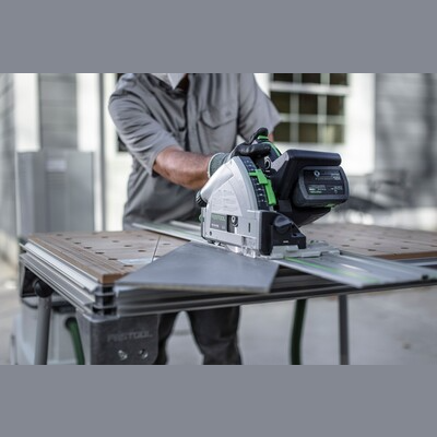 Person using Festool cordless track saw with kickback stop cutting sheet metal outdoors for power tools and home improvement