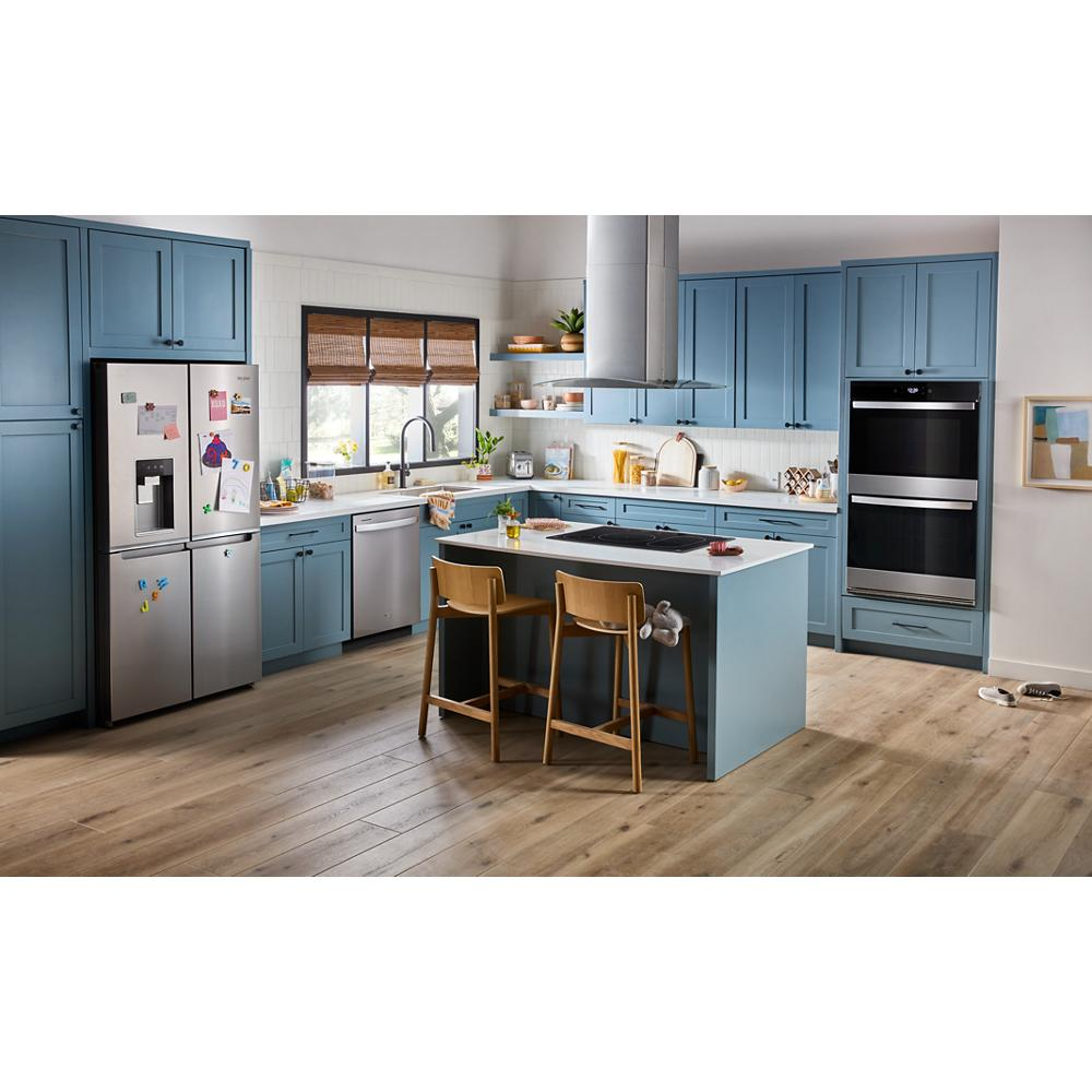 Contemporary kitchen with blue cabinetry, kitchen island, stainless steel appliances, and chimney hood in appliances collection