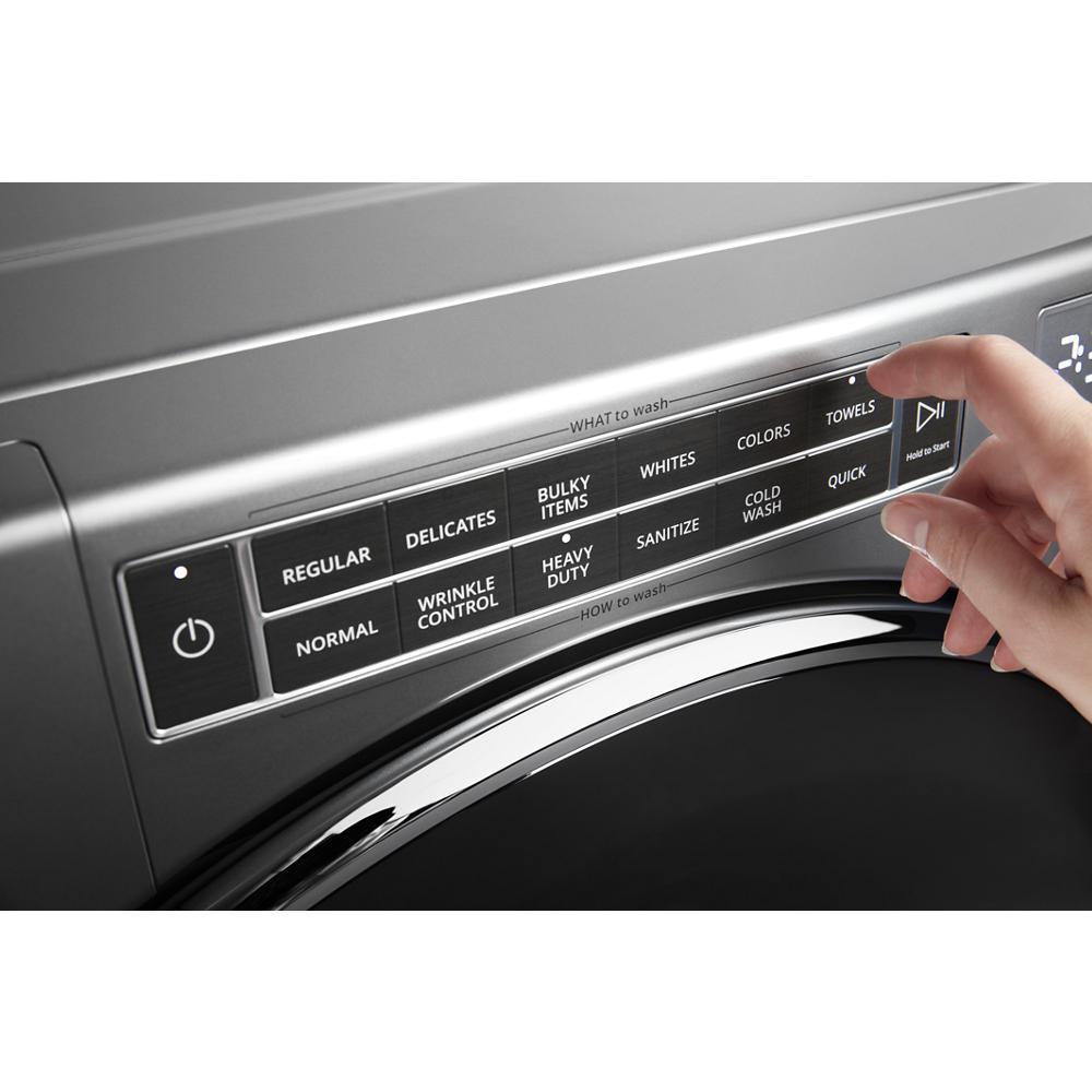 Close-up of front load washer digital control panel with cycle options for fabric types and wash settings in washers collection