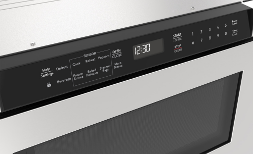 Built-in stainless steel microwave drawer with sensor cooking, digital clock, and angled touch controls from Kitchen & Kitchenware